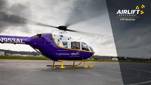 zoom background with a purple Airlift Helicopter and white and yellow Airlift Northwest logo